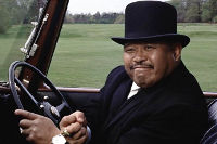 Oddjob crushes a golf ball with his bare hands